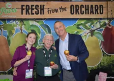 The team of USA Pears proudly shows decorative pears for the holidays. From left to right: Julia Gorby who is the granddaughter of Bob Koehler in the middle. To the right is Tim Beerup.